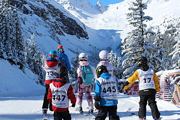 a ski instructor with kids on piste