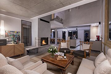 A living room with a fireplace and a marshall speaker