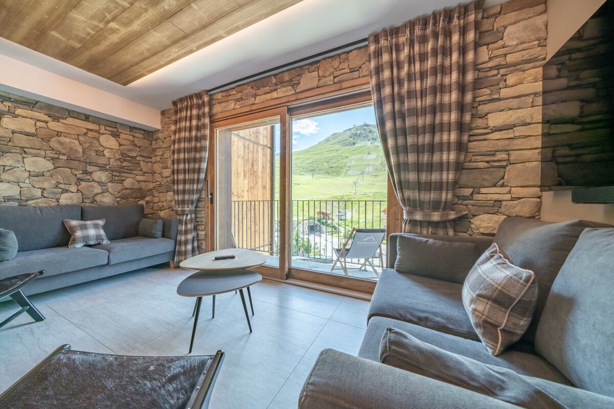 A living room with a couch and a table