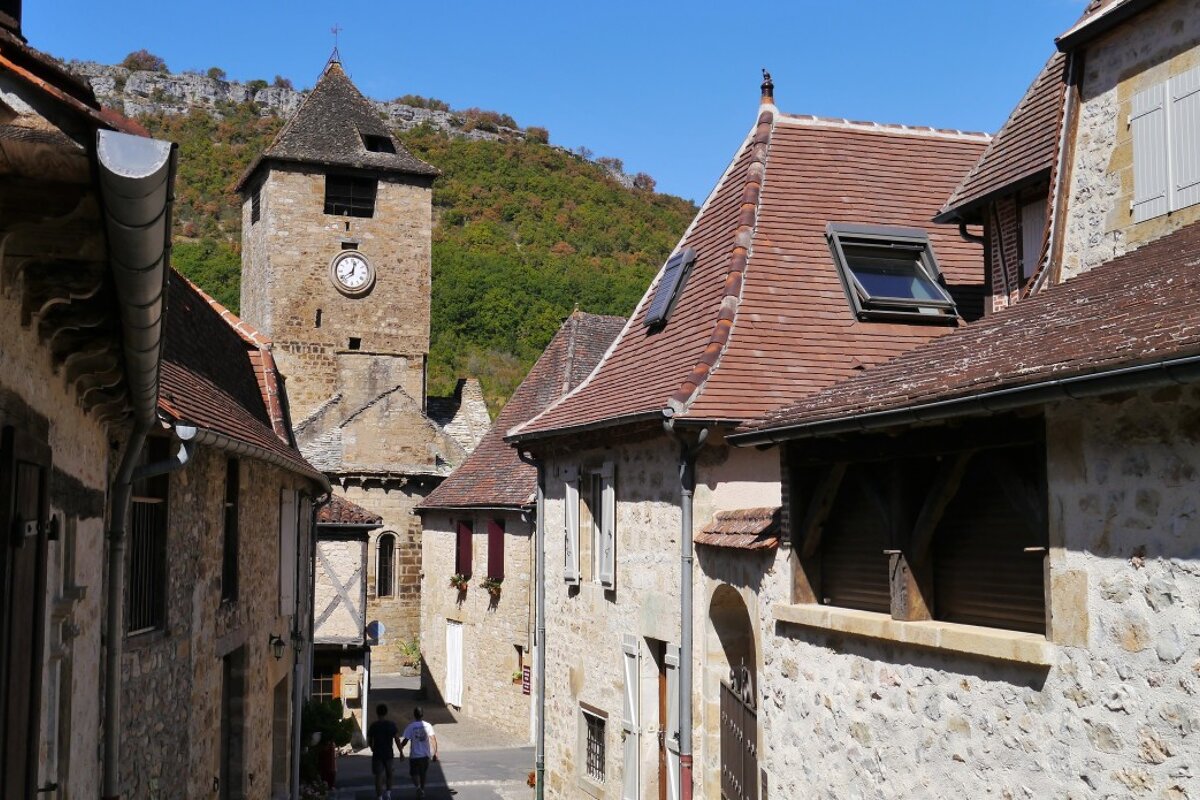 looking down a street in autoire to the church