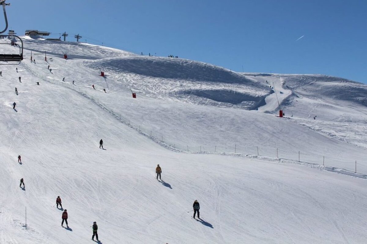 a piste with a chair lift in Val disere