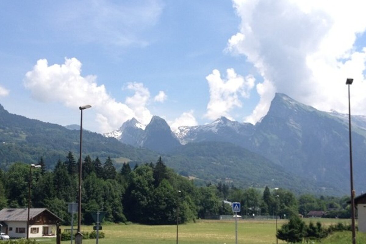a view of mountains from an alpine village