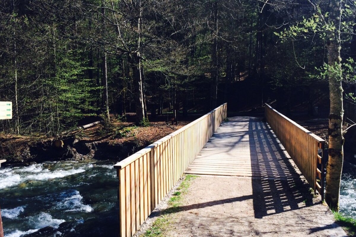 a bridge crossing the river in morzine