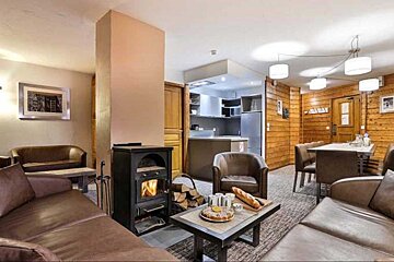 A living room with a fireplace and a table with a sign that says ' caban ' on it