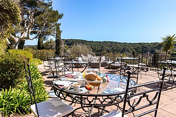 A table with a basket of bread on it