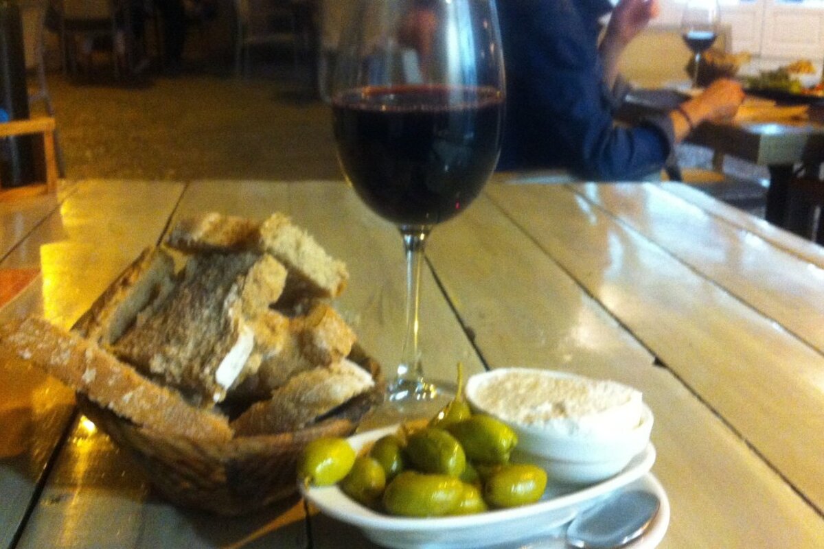 a glass of wine and nibbles in a cafe