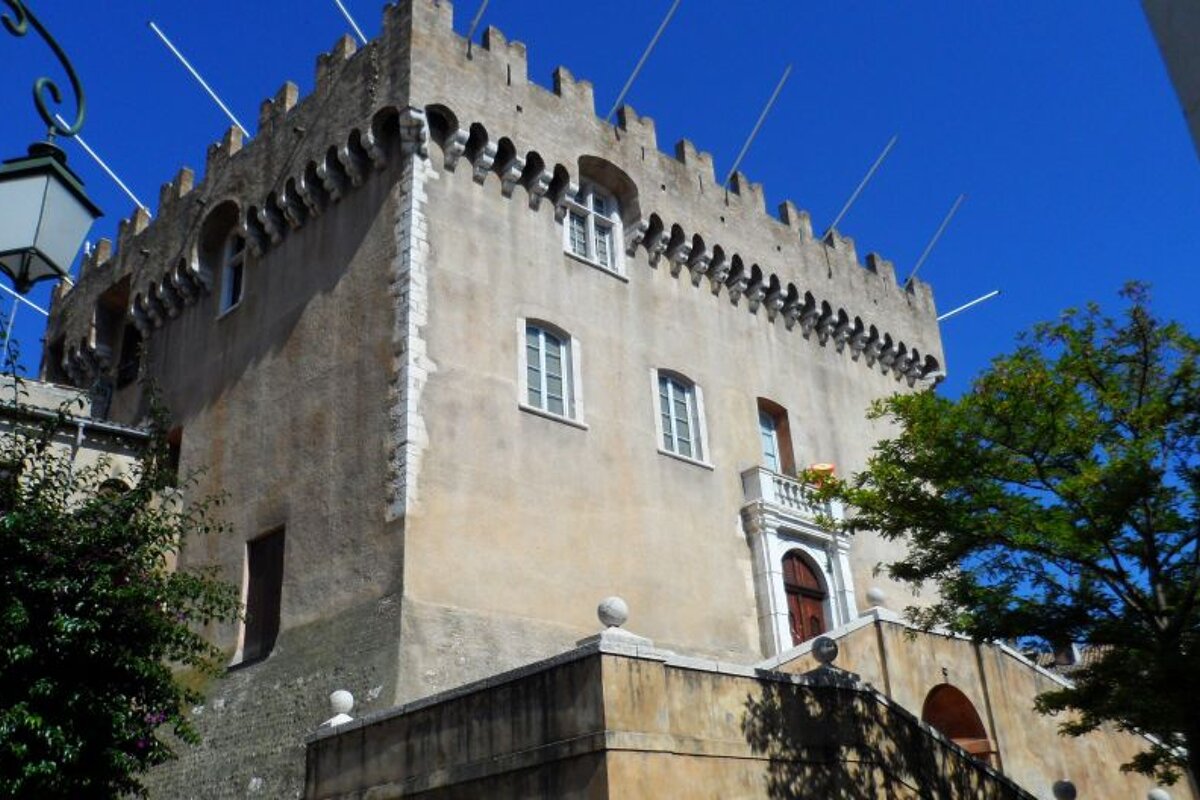 a large stone building with battlements at the top