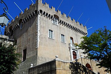 a large stone building with battlements at the top
