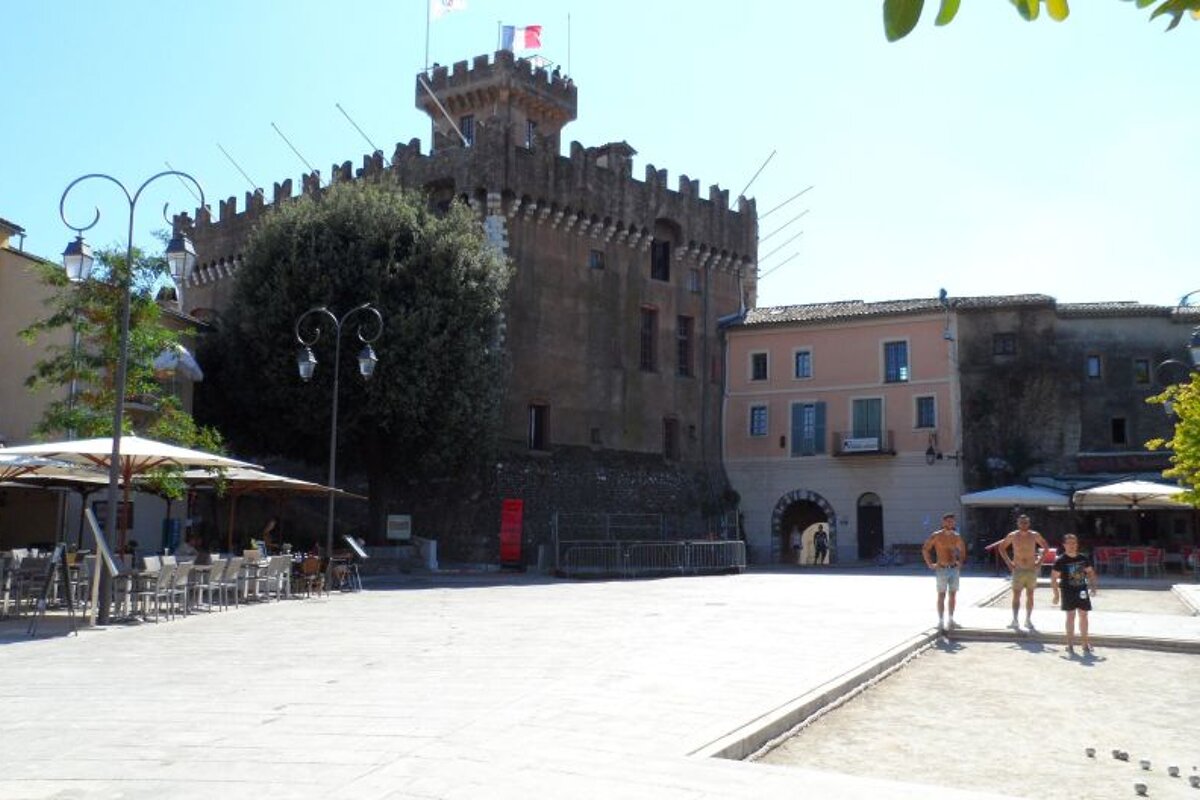 a large fortress style building in a town in Nice