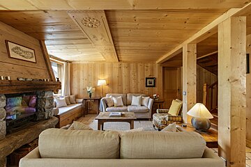 A living room with a fireplace and a couch