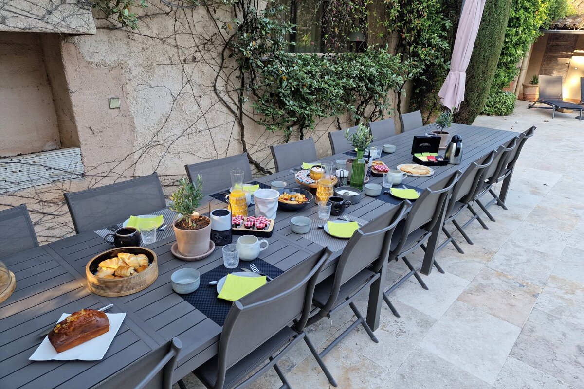 A long table with a bunch of food on it
