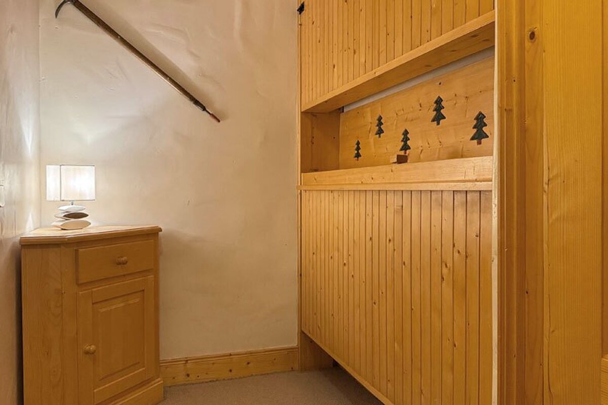 A wooden shelf with trees painted on it