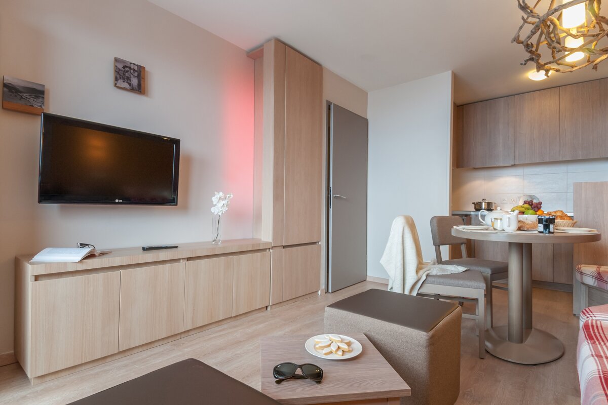 A living room with a lg flat screen tv