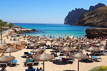 lots of beach parasols in north mallorca