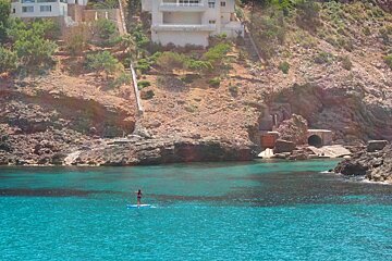someone paddle boarding in mallorca
