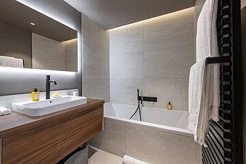 A bathroom with a sink and a bathtub