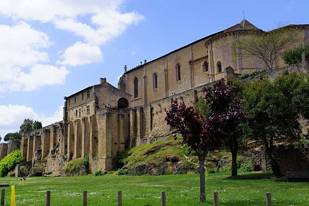 green grass. town walls and big church