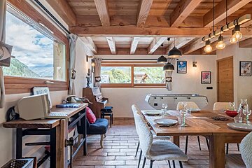 A room with a table and chairs and a sign that says world