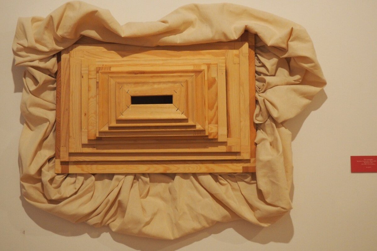 a piece or art surrounded by cloth