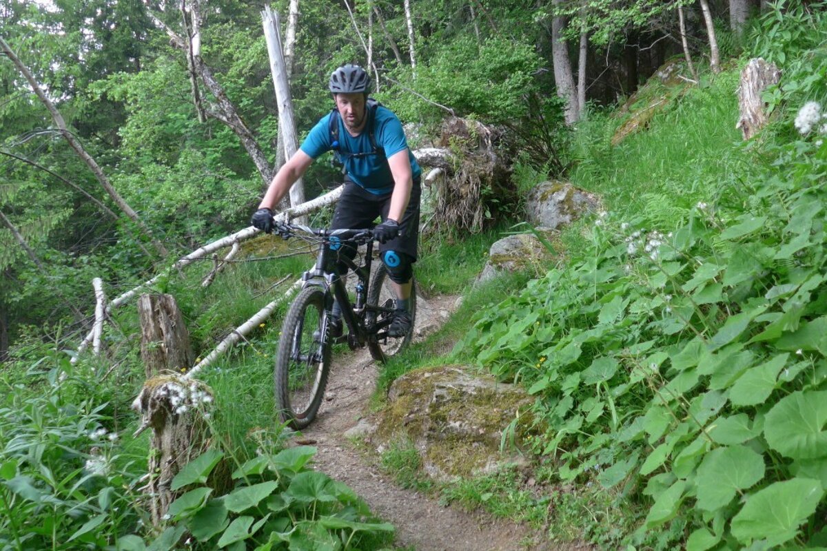 a mountain biker on a trail in chamonix centre
