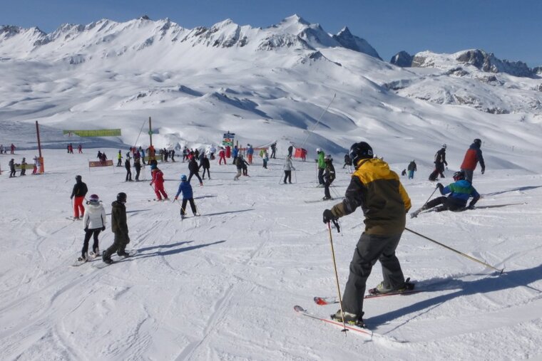 skiers on piste