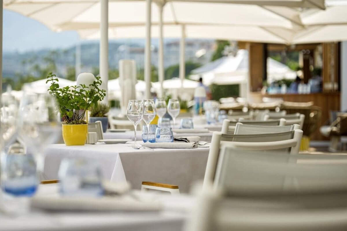 A potted plant sits on a table in a restaurant