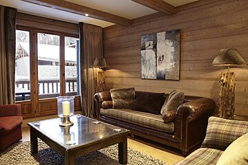 A living room with a couch and a coffee table