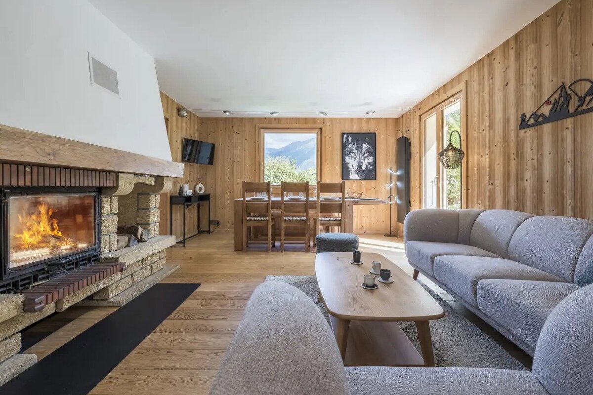 A living room with a fireplace and a couch