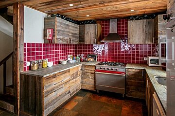 a kitchen with wooden cupboards