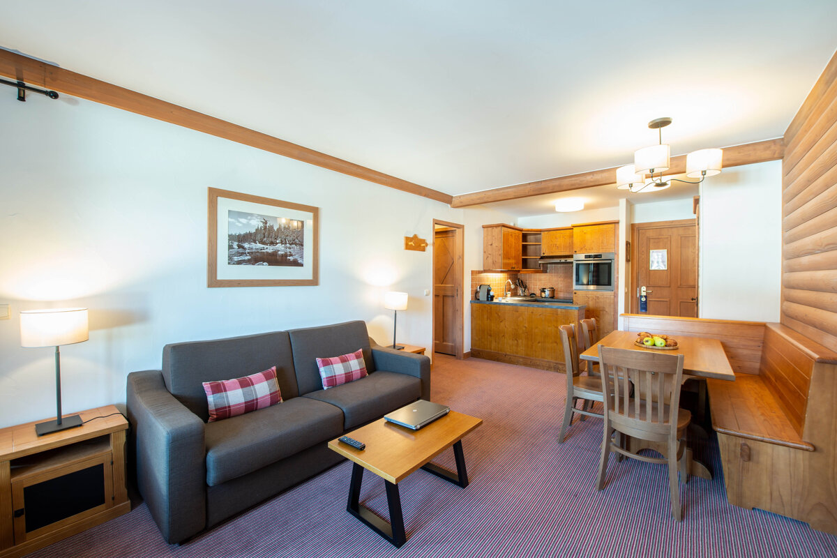 A living room with a couch and a table