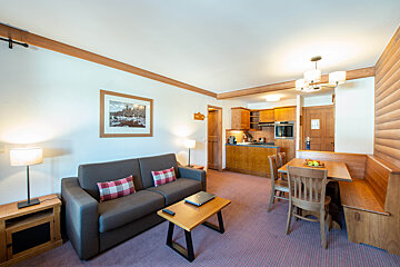 A living room with a couch and a table