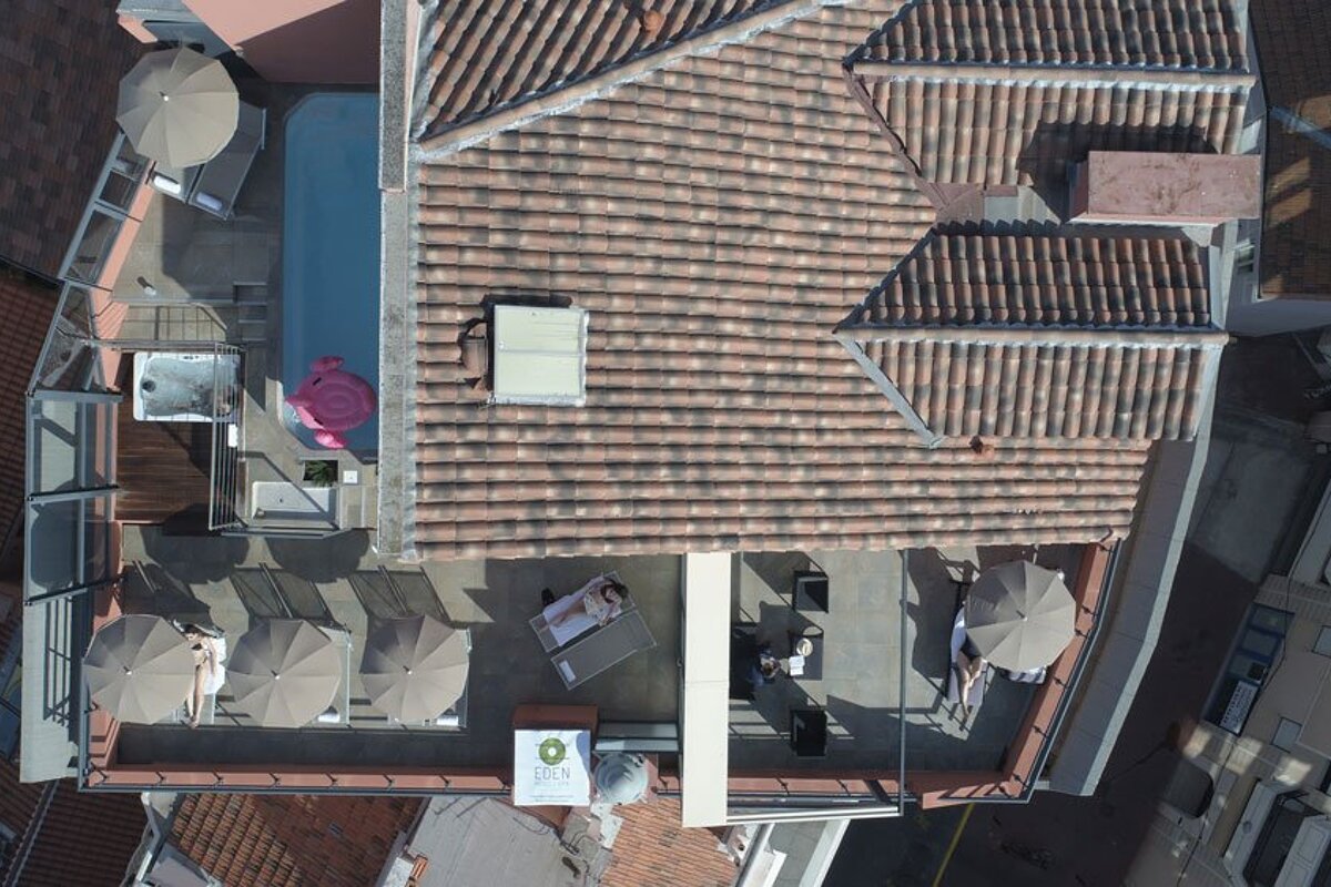 An aerial view of the roof of a building with a sign that says ' hotel ' on it