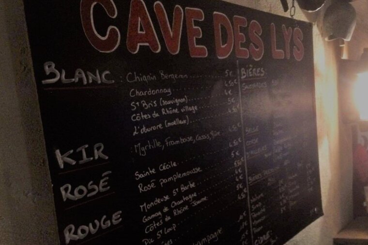 a chalk board of wine prices