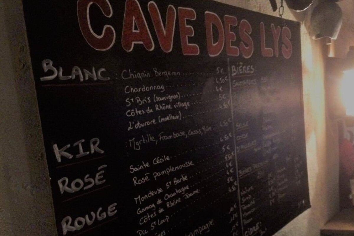 a chalk board of wine prices