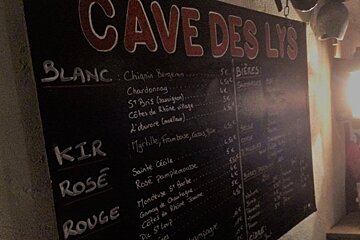 a chalk board of wine prices
