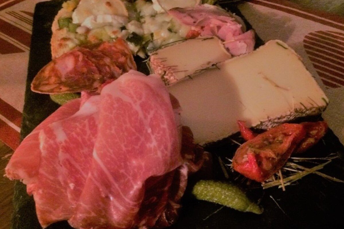 a slate of meat and cheese