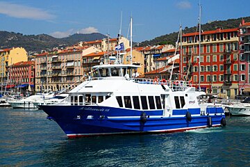 A blue and white boat with the name mediterranea on the side
