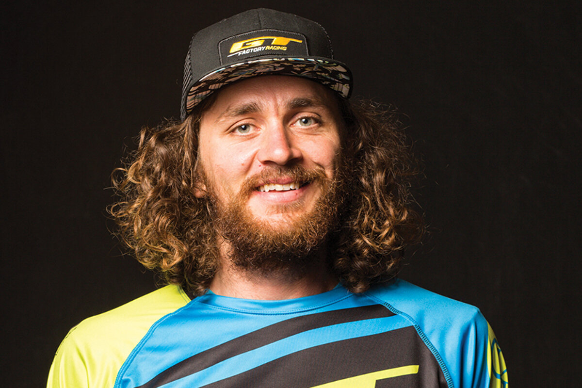 a mountain biker in a baseball cap