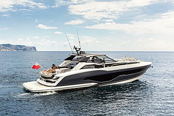 A boat with a british flag on the back of it
