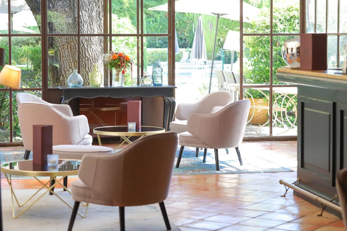 A room with chairs and tables with a menu on the table