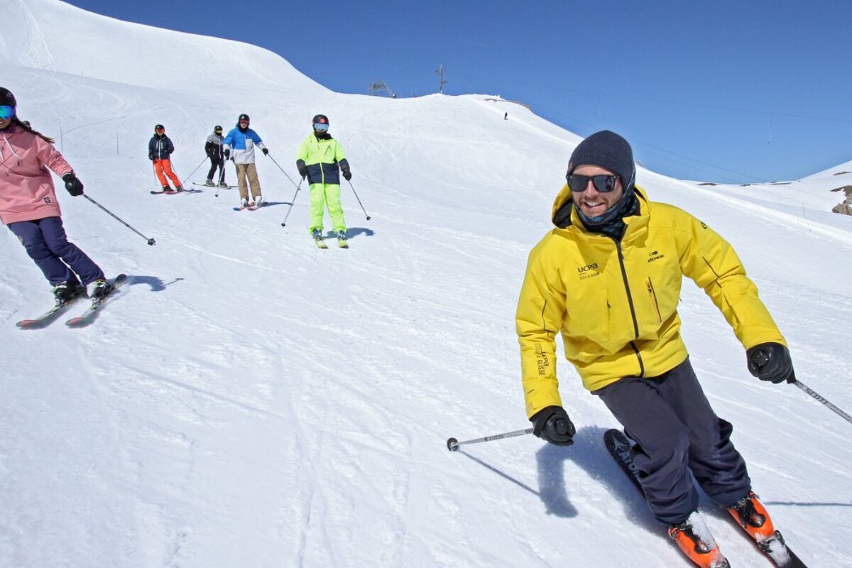 a ski instructor giving a group lesson