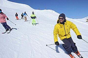 a ski instructor giving a group lesson