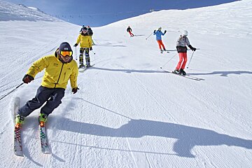 a ski instructor giving a group lesson