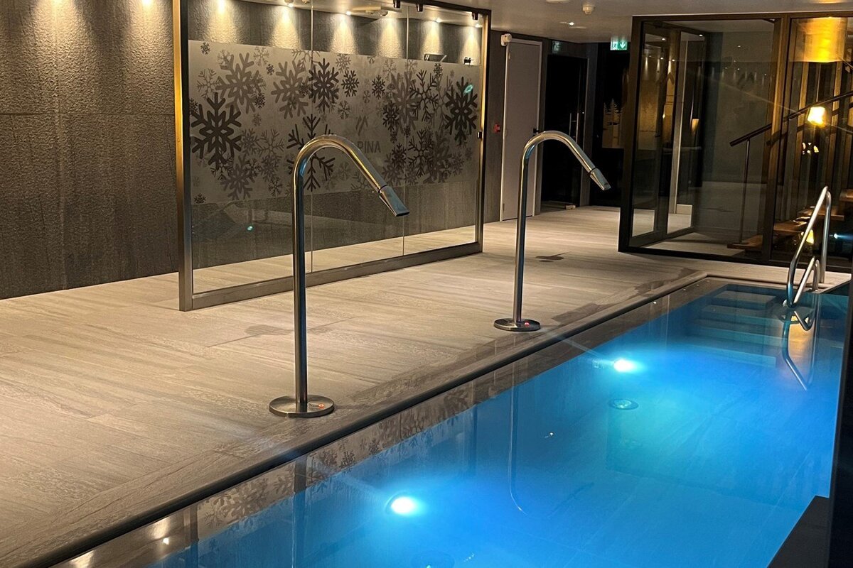 A swimming pool with a snowflake design on the wall