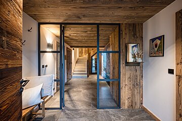 A hallway with a poster on the wall that says forzine