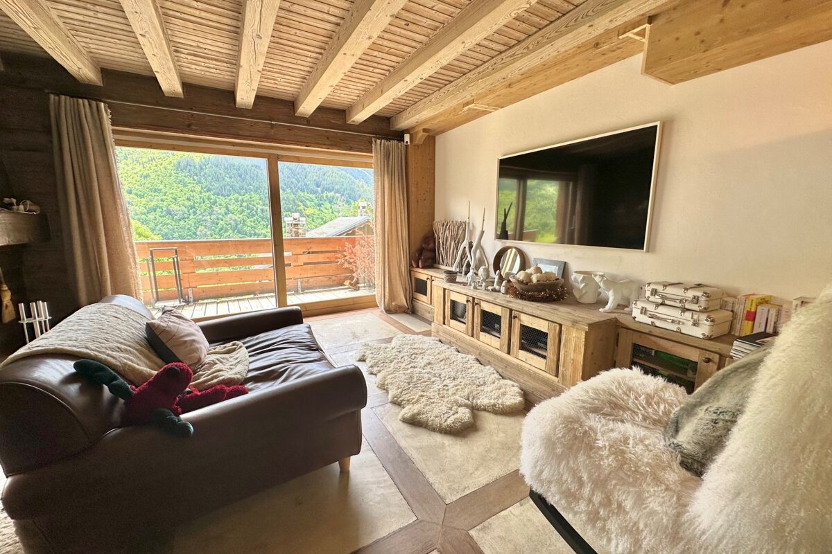 A living room with a couch and a flat screen tv