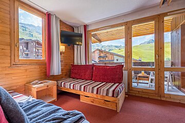 A living room with a couch and a television