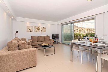 A living room with a couch and a table