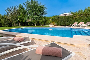 A swimming pool with a sign that says no diving
