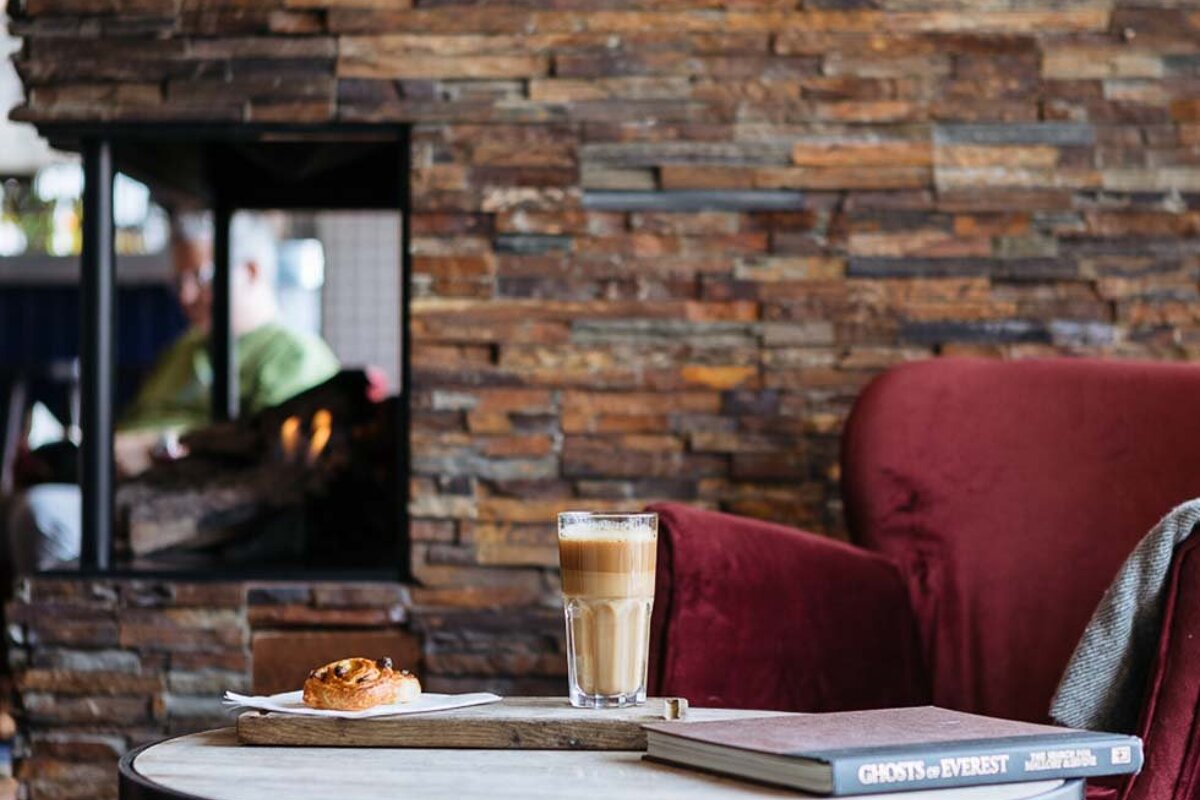 A book titled ghosts of everest sits on a table